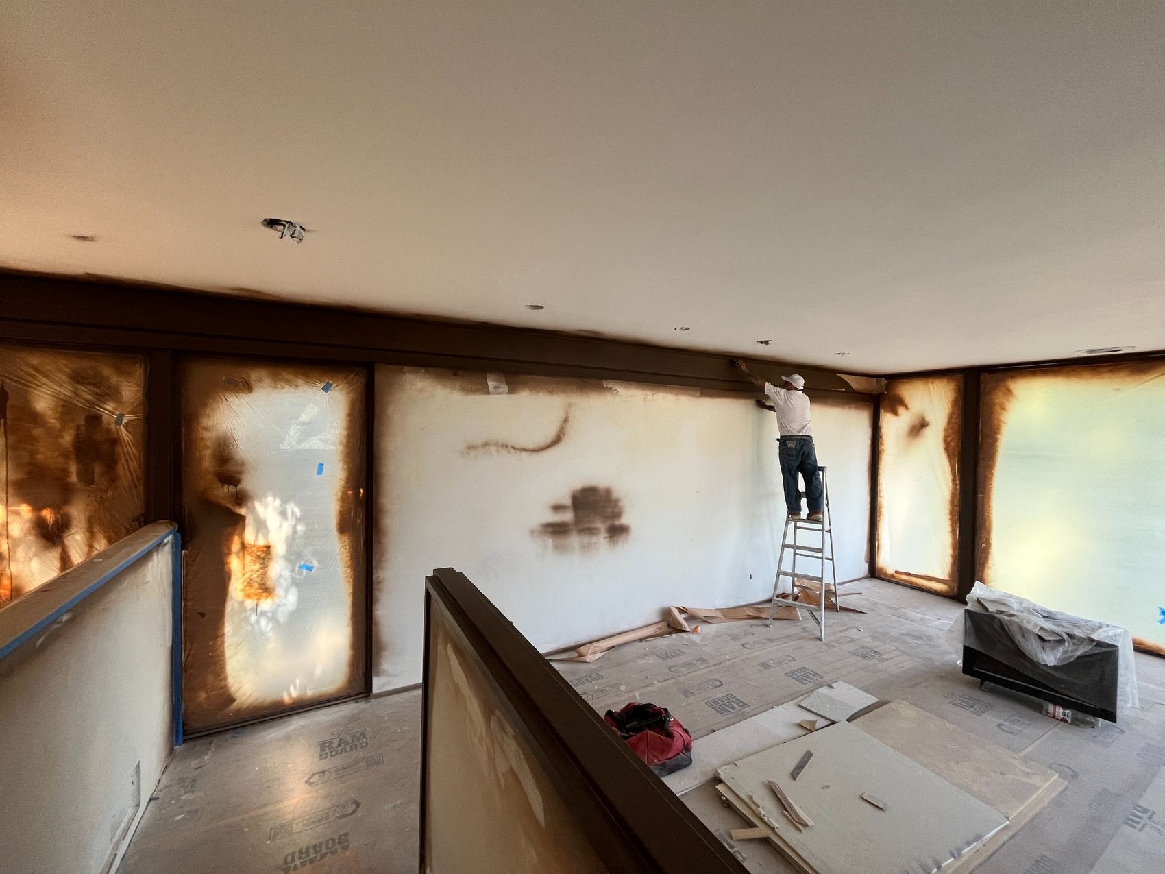 Walls and windows protected during interior painting