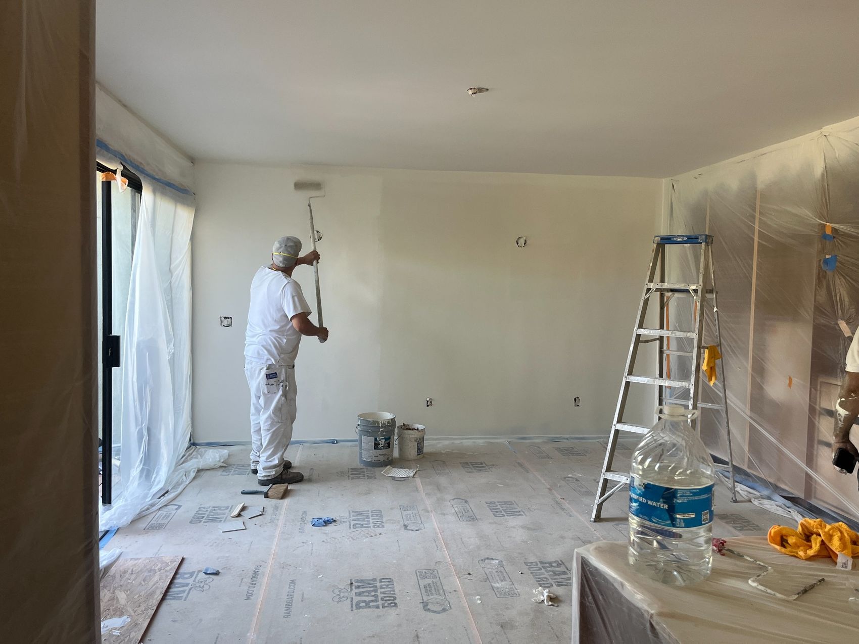 Careful wall painting and jobsite protection