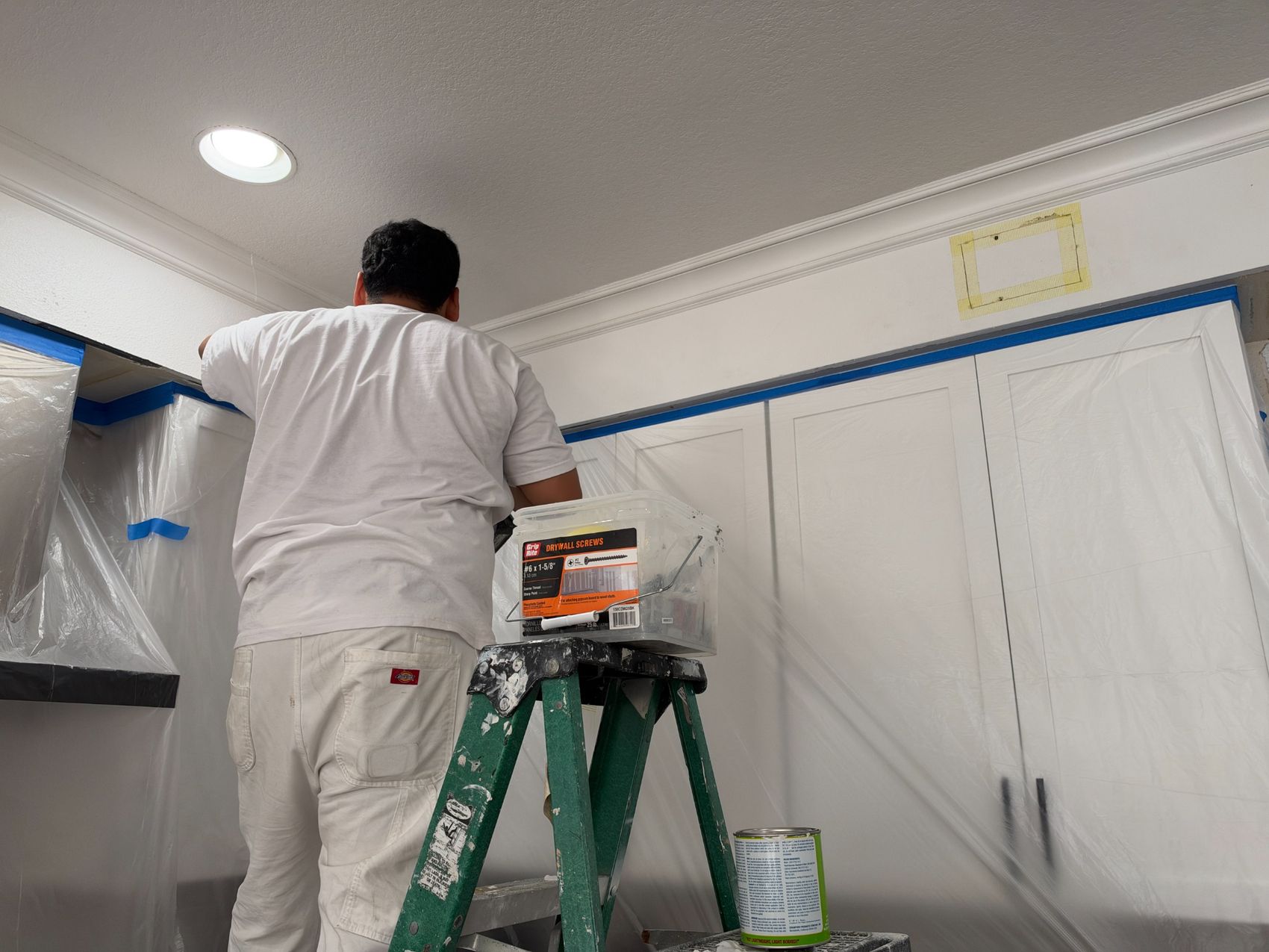 Precise masking around cabinetry and crown molding